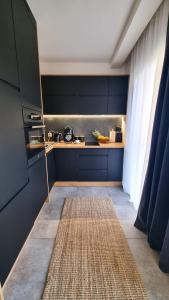 Ένα ή περισσότερα κρεβάτια σε δωμάτιο στο SUDETIA APARTMENT - Polanica Residance 8 - garaż podziemny & mini SPA w cenie