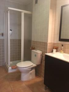 a bathroom with a toilet and a shower and a sink at Villaricos in Villaricos +19 photos
