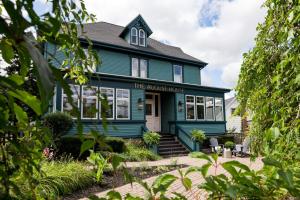 a blue house with the amazon house at The August House in Windsor