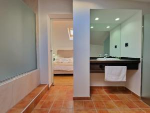 a bathroom with a sink and a mirror at HOSTAL HS CEHEGIN in Cehegín
