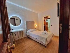 Ένα ή περισσότερα κρεβάτια σε δωμάτιο στο HOSTAL HS CEHEGIN