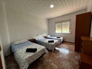 Katil atau katil-katil dalam bilik di Casa Con Piscina Privada Marenyet