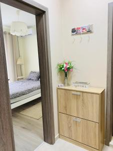 a room with a bedroom with a bed and a mirror at Kiwi Gardens in Byala +39 photos