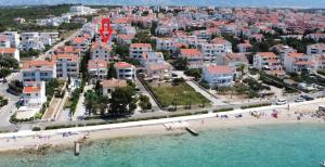 an aerial view of a beach and a city at Son de Mar Novalja-Pag Apartment in Novalja