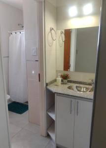 a bathroom with a sink and a mirror at Alma de Acacia Lodge in San Rafael