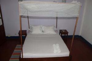 Un ou plusieurs lits dans un hébergement de l'établissement Hotel Kartiffa