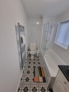a bathroom with a toilet and a shower and a sink at 1 bedroom Windy Nook -Great monthly offers in Sheriff Hill