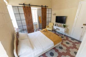 Postel nebo postele na pokoji v ubytování Tinja Bnb