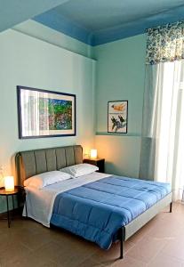 Ένα ή περισσότερα κρεβάτια σε δωμάτιο στο LE VOCI DELLA FONTANA