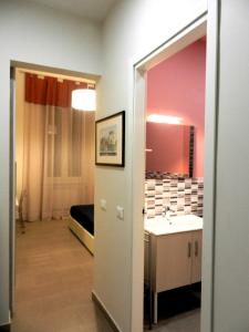 Ένα ή περισσότερα κρεβάτια σε δωμάτιο στο LE VOCI DELLA FONTANA