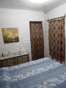 מיטה או מיטות בחדר ב-"Mi pequeño refugio" - Apartamento Colonia del Sacramento