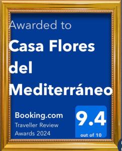 a sign for the ccasa flores mediterranean at Casa Flores del Mediterráneo in Badalona