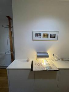 a white counter with a paper on top of it at Luxury 2Bed 2Bath City View Flat in London
