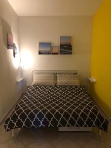 Postel nebo postele na pokoji v ubytování LuGa Apartments