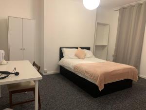 Ένα ή περισσότερα κρεβάτια σε δωμάτιο στο Warren Street Guest House