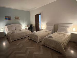 Postel nebo postele na pokoji v ubytování B&B Prime Sant'Agostino