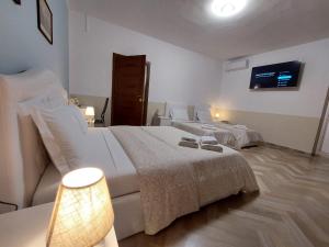 Postel nebo postele na pokoji v ubytování B&B Prime Sant'Agostino