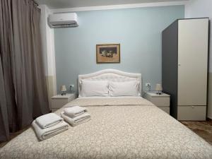 Postel nebo postele na pokoji v ubytování B&B Prime Sant'Agostino