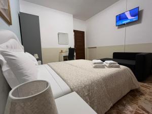 Postel nebo postele na pokoji v ubytování B&B Prime Sant'Agostino
