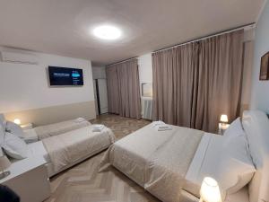 Postel nebo postele na pokoji v ubytování B&B Prime Sant'Agostino