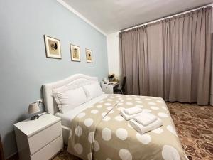 Postel nebo postele na pokoji v ubytování B&B Prime Sant'Agostino
