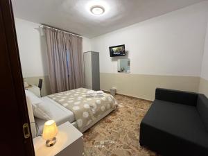 Postel nebo postele na pokoji v ubytování B&B Prime Sant'Agostino