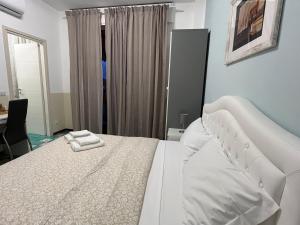 Postel nebo postele na pokoji v ubytování B&B Prime Sant'Agostino