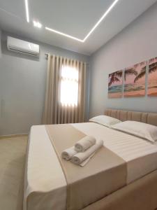 Postel nebo postele na pokoji v ubytování BP Beach Apartments
