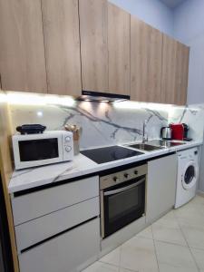 Kuchyň nebo kuchyňský kout v ubytování BP Beach Apartments