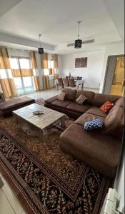 a living room with two couches and a coffee table at F4 moderne au centre ville d'oran in Oran