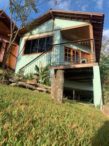 a house on the side of a hill at Pouso Lumiar in Lavras Novas