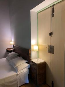 Katil atau katil-katil dalam bilik di Agriturismo Barchessa