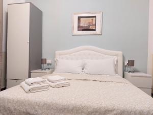 Postel nebo postele na pokoji v ubytování B&B Prime Sant'Agostino