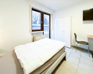 Un pat sau paturi într-o cameră la Privatzimmer in Karlsbad