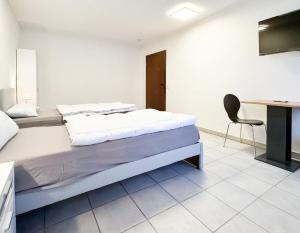 Łóżko lub łóżka w pokoju w obiekcie Privatzimmer in Karlsbad