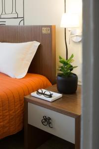 Postel nebo postele na pokoji v ubytování Serenata Hotel & Hostel Coimbra