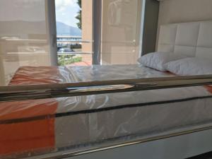 a close up of a bed in a room at Sea Star Danica apartments in Tivat