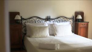 Katil atau katil-katil dalam bilik di Agriturismo Barchessa