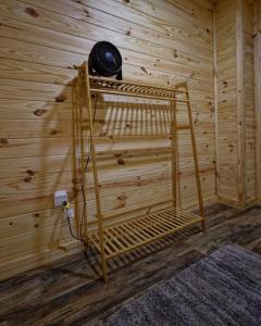 a room with a wooden wall with a wooden bunk bed at The Lodge at Welch in Welch