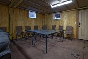 a conference room with a table and chairs in it at The Lodge at Welch in Welch
