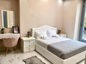 a bedroom with a white bed and a mirror at Nido dei Cigni in Turin