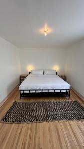 a bedroom with a bed in a room with a rug at The Parador in Santa Fe