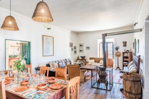 a living room with a table and chairs at Fundo Chincheros Lodge in Puno