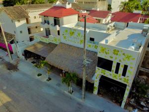 an overhead view of a building with yellow flowers on it at Hotel Boutique Eden Costa in Santa Cruz Huatulco