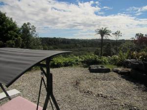 a gazebo with a view of a field at Beaconstone Eco Stay - off grid retreat in Charleston