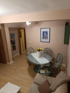 a living room with a table and chairs at Apartamento Turistico La Cañada in Guadalajara