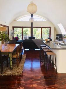 a kitchen and dining room with a table and chairs at Cocoon House in Newbury