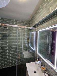 a bathroom with a glass shower and a sink at Casa Domingos Cales De Mallorca in Calas de Mallorca +22 photos