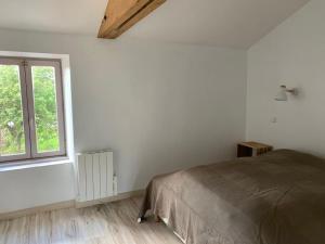 Giường trong phòng chung tại Maison de campagne en Vendée