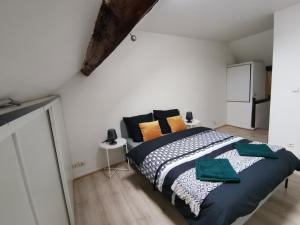 Ένα ή περισσότερα κρεβάτια σε δωμάτιο στο Green Horizon Château Thierry